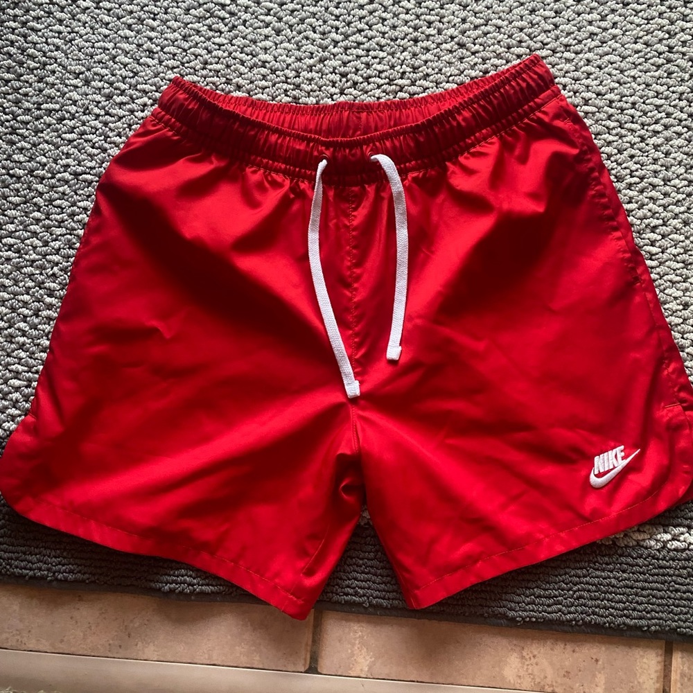small men’s red satin Nike shorts